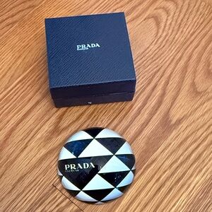 Prada Eyewear paper weight.